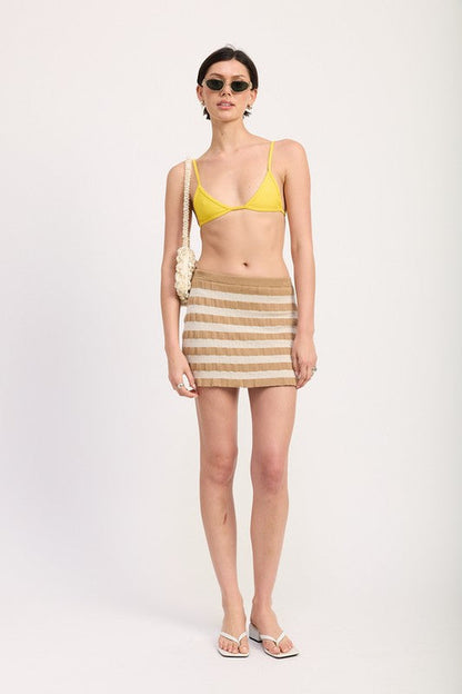 Automotive striped ribbed knit mini skirt by Jade Icarus, featuring a fitted ribbed design with colorful stripe pattern.