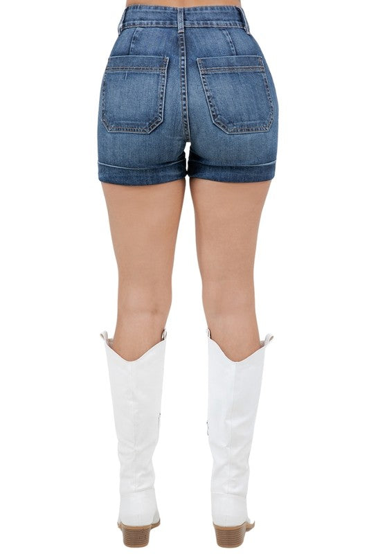 Dark wash Willow Denim Short by Jade Icarus, automotive accessory with denim-style design, shown in a close-up image.