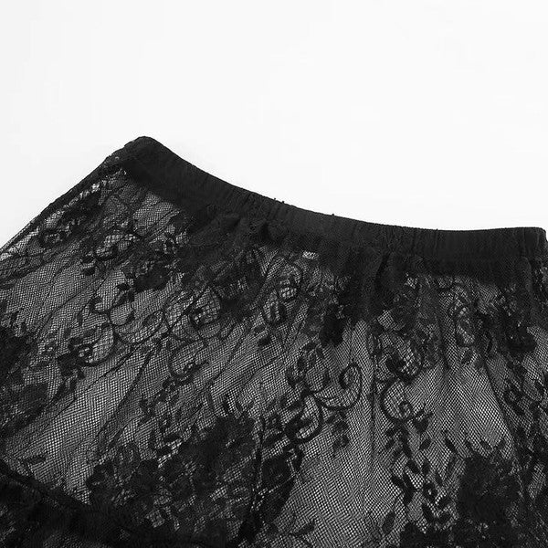 Floral lace ruffled maxi skirt by Jade Icarus, showcasing intricate lace details and flowing ruffle design.