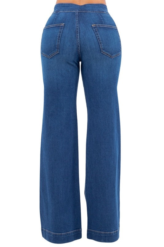 Jade Icarus Robin wide-leg flare jeans in medium blue denim, displayed on a model, showcasing the relaxed fit and stylish cut.