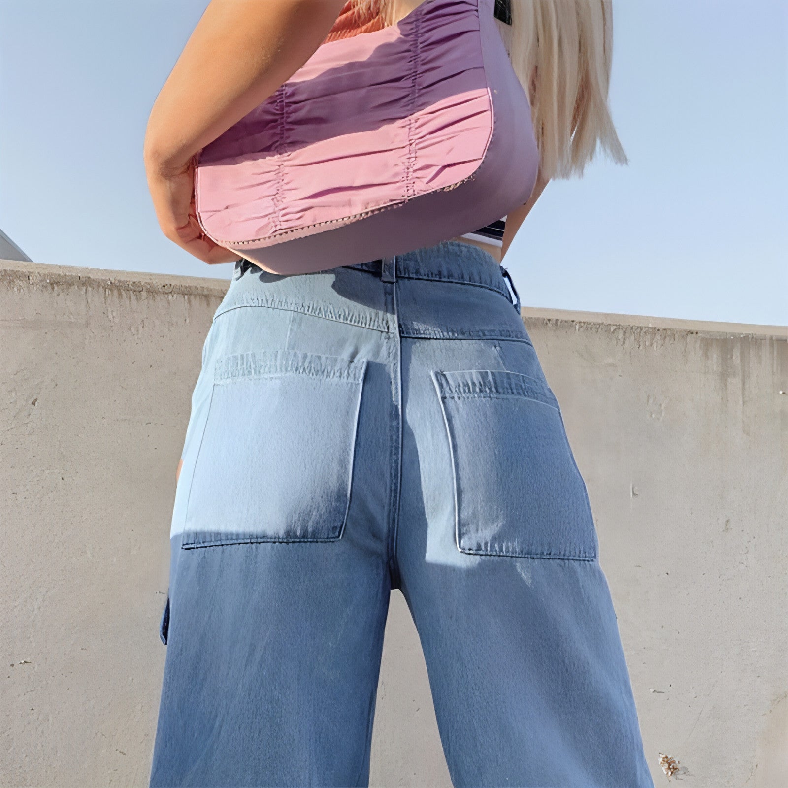 Women’s washed loose-fit jeans with large pockets from Carmine Juneberry, showcasing relaxed denim style and casual comfort.