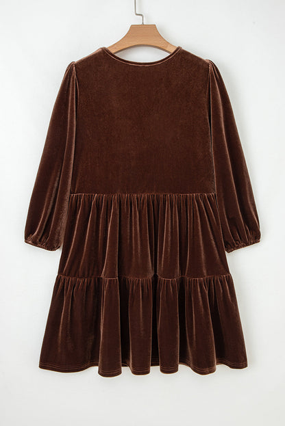 Velvet V-neck long sleeve tiered mini dress for women by Byzantium Bay, featuring a stylish, flowy silhouette and elegant design.