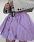 Striped bubble mini skirt by Jade Icarus, featuring bold horizontal stripes and a playful, bubble-style design.