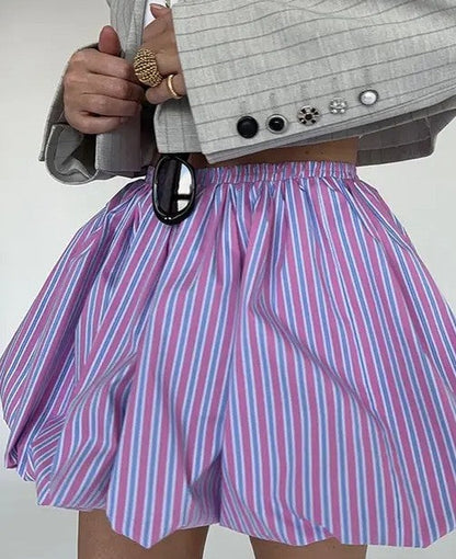 Striped Bubble Mini Skirt by Jade Icarus featuring bold multicolored stripes and a playful, rounded bubble hem design.