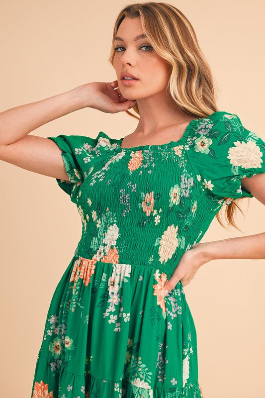 Green Jade Icarus tiered lightweight midi dress for women, showing its flowing fabric and tiered design.