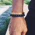 Fuchsia Molly ruler bracelet with adjustable strap and engraved measurement markings, stylish accessory for everyday wear.