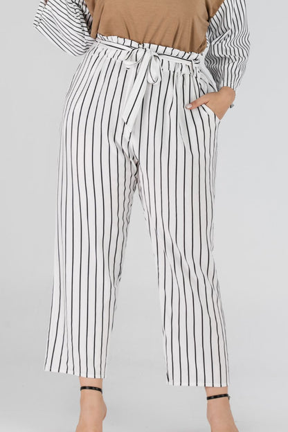 Striped paperbag waist cropped pants by Pear Daisy, showcasing the stylish design and comfortable fit in a home and garden setting.