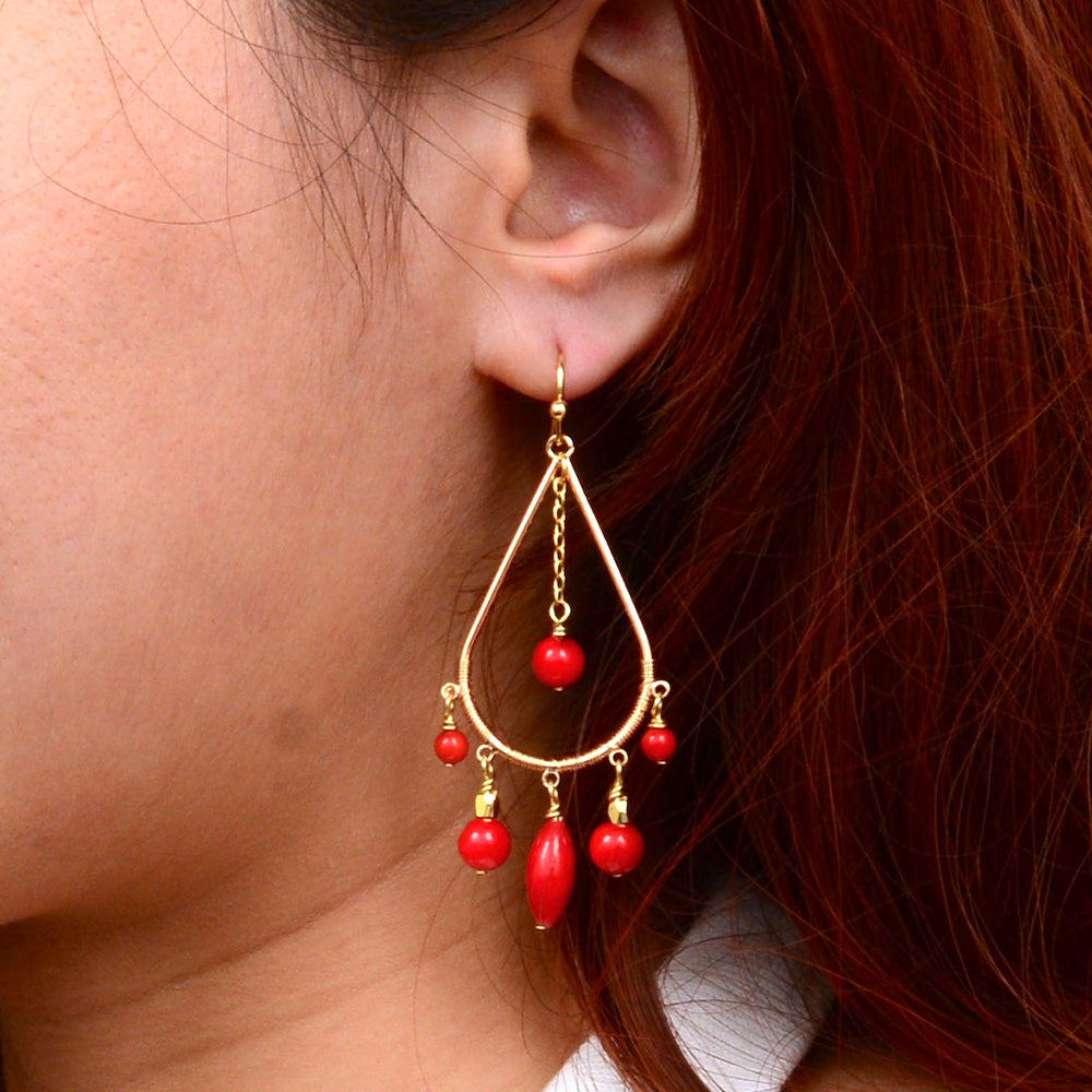 Red Mashan jade and gold chandelier earrings with intricate jewelry design, featuring vibrant red and gold accents.