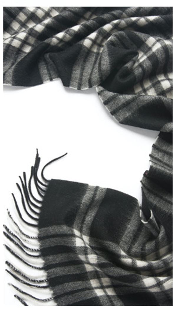 Black and white woven lambswool scarf from Start2Finish, featuring a checkered pattern and soft, cozy texture.