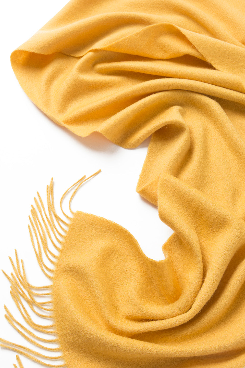 Yellow woven lambswool scarf from Start2Finish, showcasing a plain, soft, and cozy apparel accessory with textured fabric.