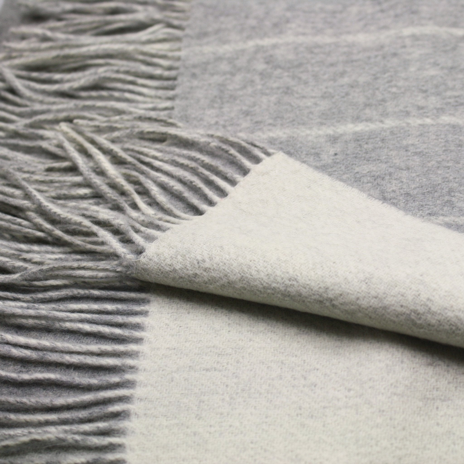 Silver grey wool-white striped cashmere woven double face scarf from Start2Finish, showcasing soft, luxurious fabric and stylish pattern.
