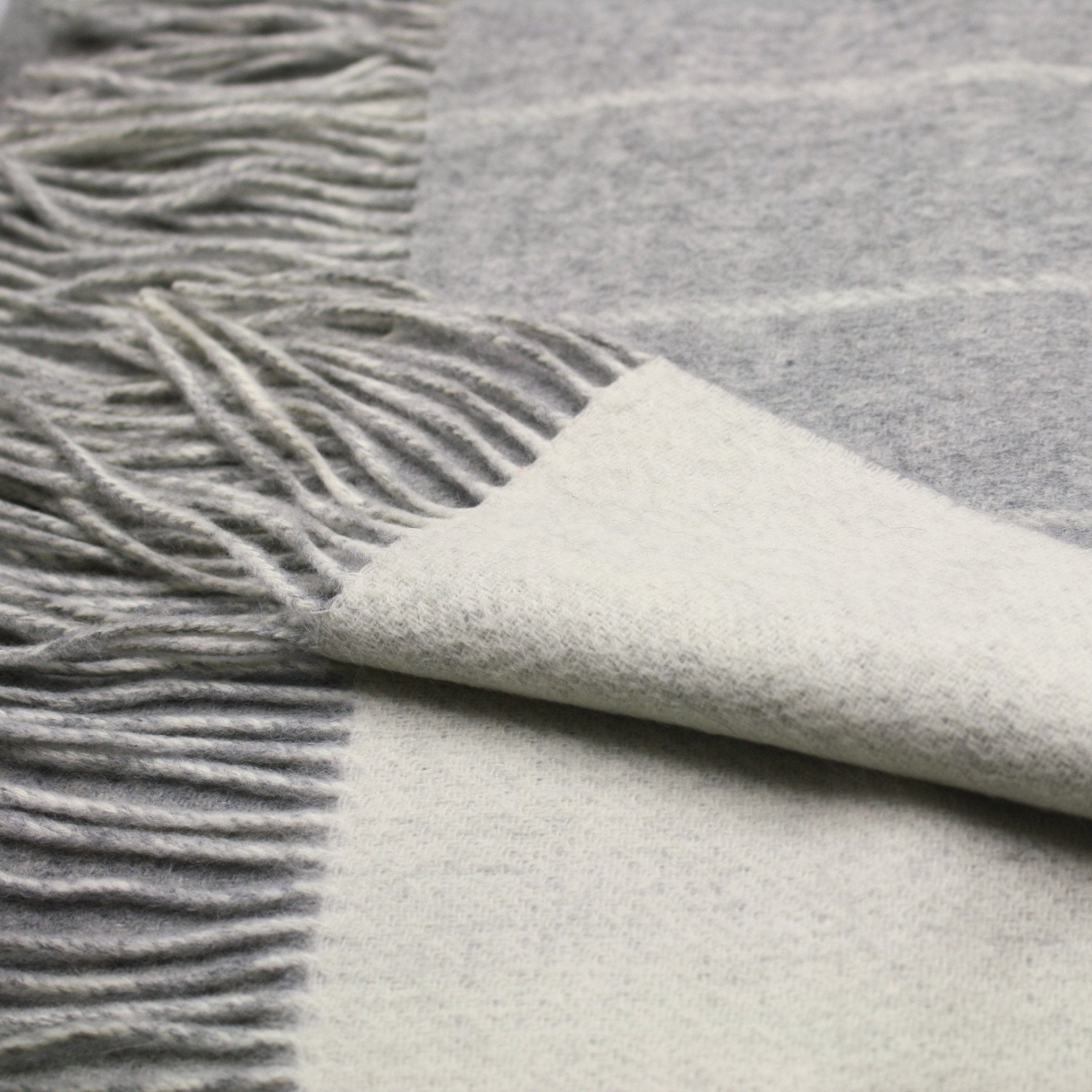 Silver grey wool-white striped cashmere woven double face scarf from Start2Finish, showcasing soft, luxurious fabric and stylish pattern.