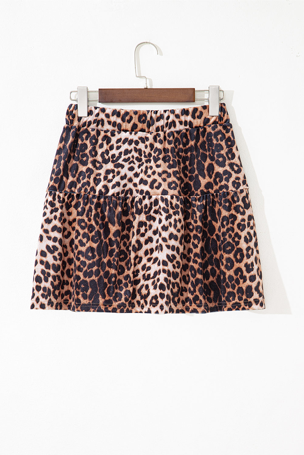 Leopard tiered patchwork mini skirt from Byzantium Bay showing a stylish, layered skirt with leopard print and patchwork details.