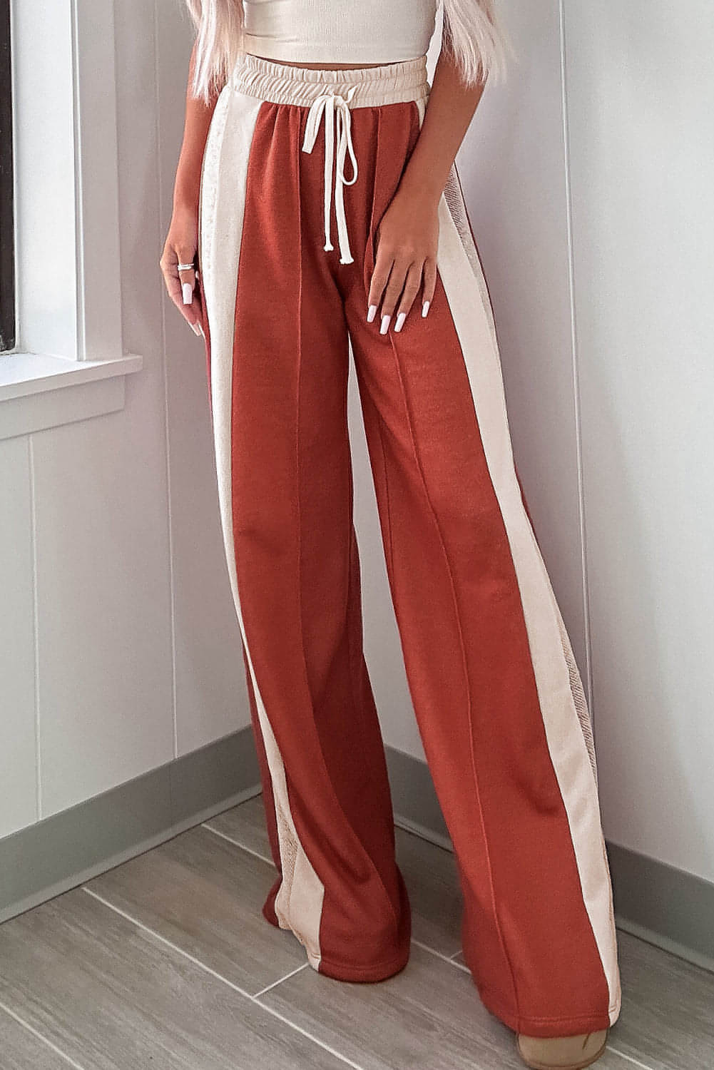 Carmine Juneberry flamingo color block high waist wide leg drawstring pants displayed on a model.