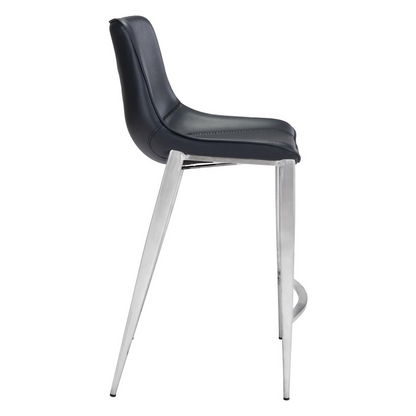 Pair of Magnus Counter Stools by Start2Finish with black seats and silver metal legs, placed around a kitchen counter.