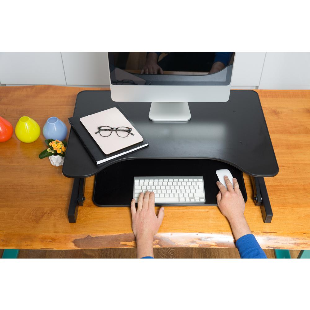Start2Finish Rocelco 32-inch height adjustable standing desk with a sleek wooden surface and metal frame.