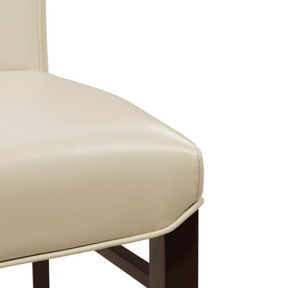 Set of two Start2Finish Milton bonded leather dining side chairs with cushioned seats and sleek wooden legs.