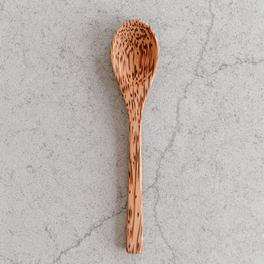Wooden coconut spoon from Yellow Lavender, natural handcrafted kitchen utensil for cooking and serving with a coconut design.