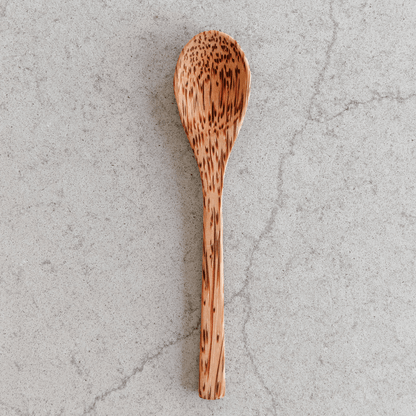Wooden coconut spoon from Yellow Lavender, natural handcrafted kitchen utensil for cooking and serving with a coconut design.