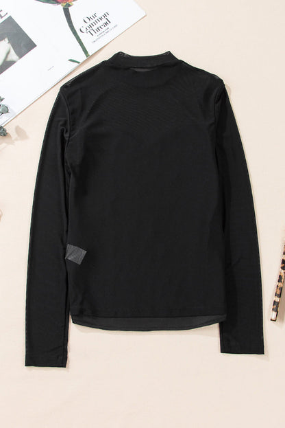 Black sequin velvet sheer mesh mock neck blouse by Carmine Juneberry, featuring elegant sequined details and a stylish sheer fabric.