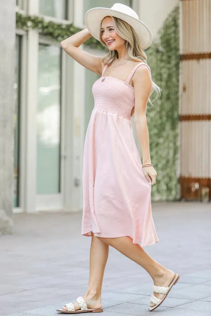 Jade Icarus smocking open-back sleeveless midi dress for women, featuring a fitted bodice and flowing skirt in a stylish design.