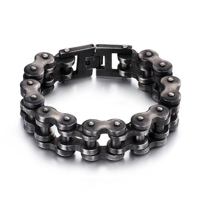 Fuchsia Molly bike chain bracelet with metallic links, stylish unisex jewelry accessory on a neutral background.