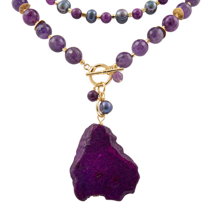 Purple amethyst and jasper pendant necklace featuring a gold-tone jewelry piece with a gemstone design.