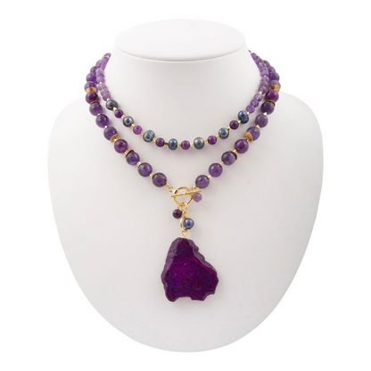 Purple amethyst and jasper pendant necklace featuring a gold-tone jewelry piece with intricate gemstone details.