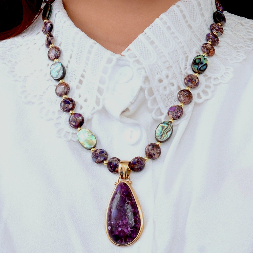 Purple turquoise and gold pendant necklace from Start2Finish jewelry featuring a vibrant, eye-catching design.