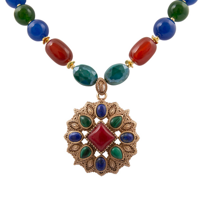 Luscious red quartz golden pendant jewelry featuring a sparkling jeweled red quartz gemstone on a gold setting.