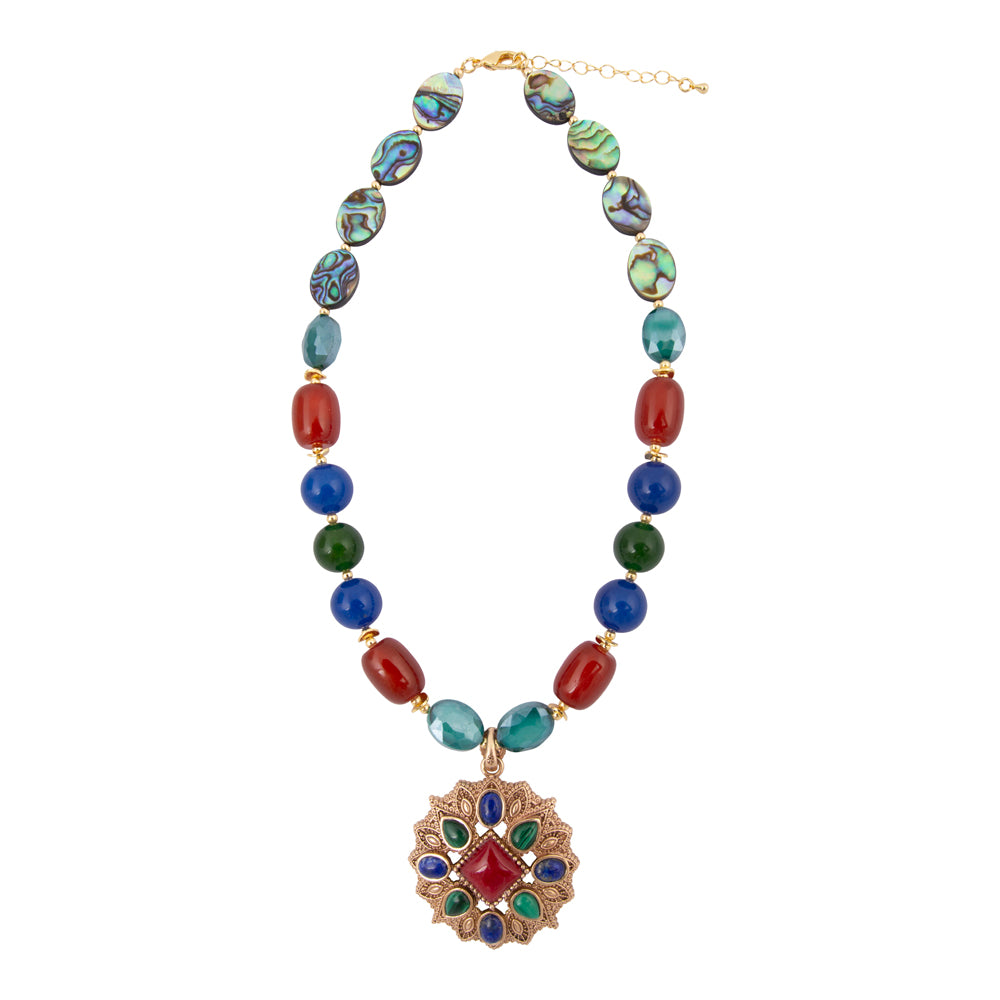 Luscious jeweled red quartz golden pendant jewelry with intricate design, featuring a vibrant red gemstone on a gold chain.