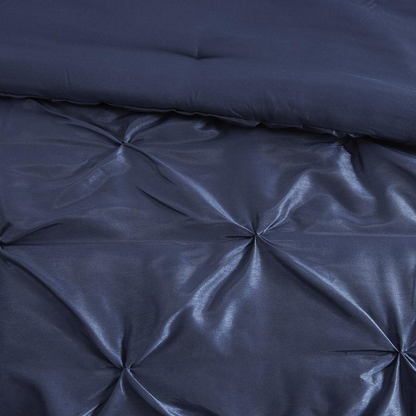 Start2Finish Laurel 7-piece navy tufted comforter bedding set with matching pillow shams and decorative accents.