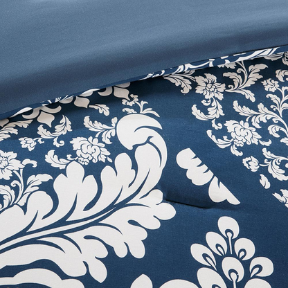 Vienna 7-piece cotton printed comforter set in indigo color showing a floral pattern and matching pillow shams for bedding.