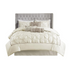 Start2Finish Laurel 7-piece ivory tufted comforter set with matching shams and decorative pillows on a bed.