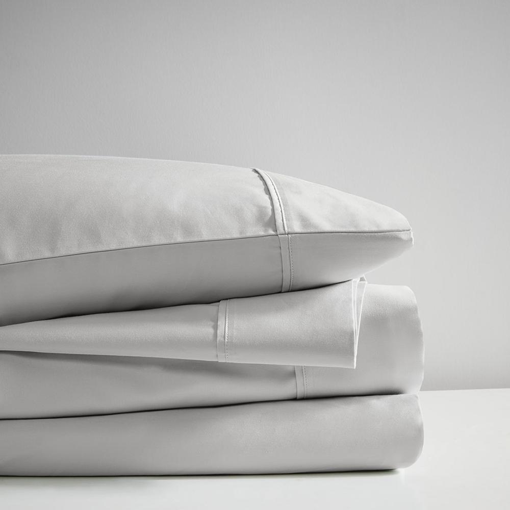 Start2Finish Pima cotton sheet set with smooth, white bed sheets and pillowcases laid out on a neatly made bed.