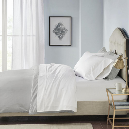 Start2Finish Pima Cotton Sheet Set showing smooth, white bed sheets and pillowcases on a neatly made bed.
