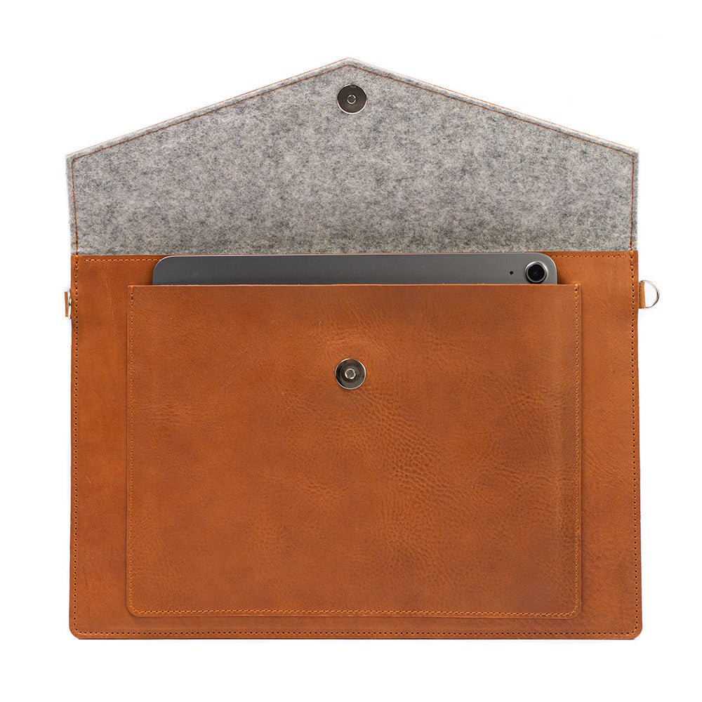 Start2Finish leather MacBook bag with an iPad pocket, stylish accessories case for carrying tech devices securely.