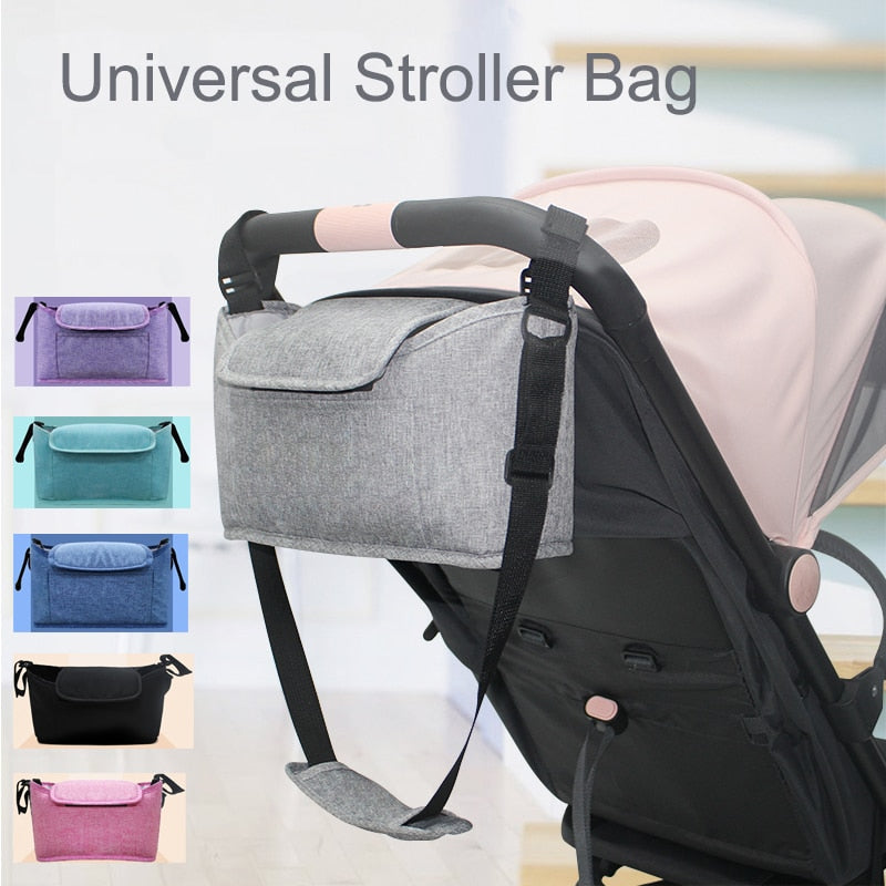Maroon Asteria stroller bag and pram organizer with multiple compartments, attached to a stroller for parent and baby essentials.