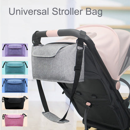 Maroon Asteria stroller bag and pram organizer with multiple compartments, attached to a stroller for parent and baby essentials.
