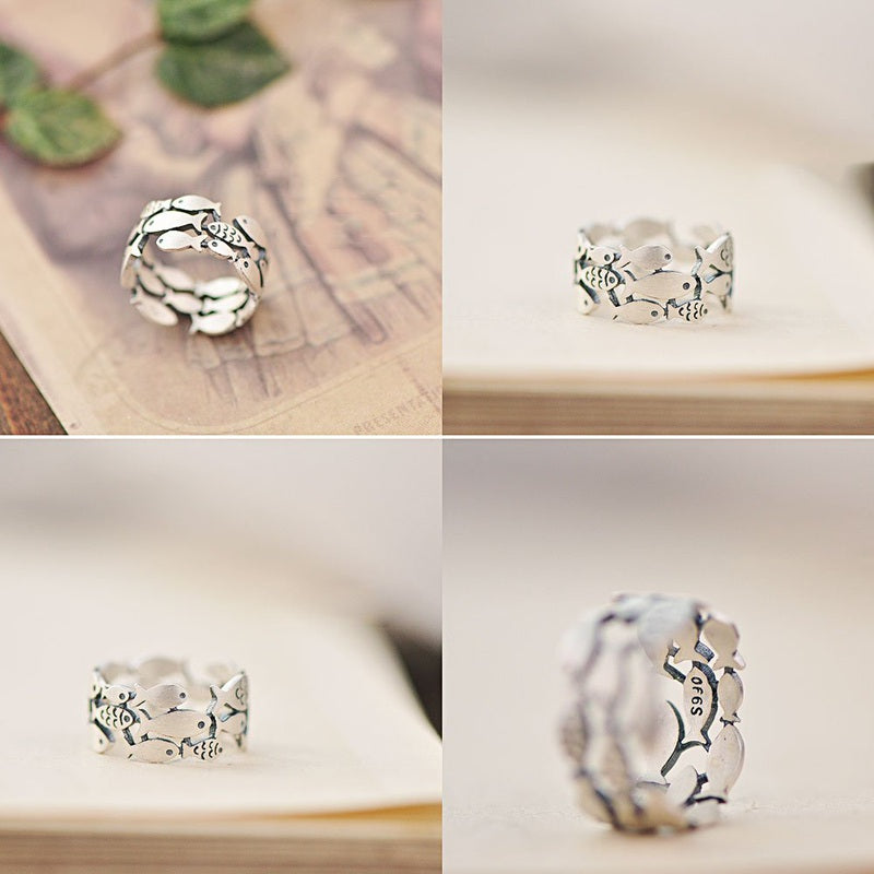 Silver fish-shaped ring from Fuchsia Molly, showcasing intricate design on a sleek silver band.