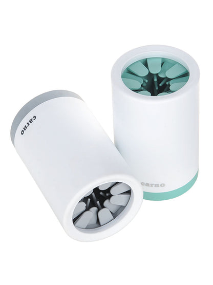 Maroon Asteria portable pet paw cleaner cup with soft silicone comb for gentle paw cleaning, shown in use.