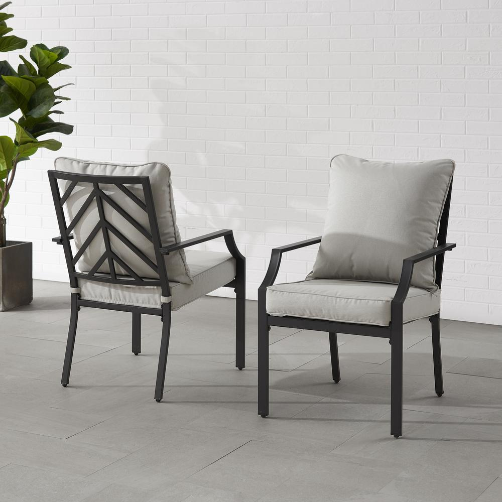 Otto 2-piece outdoor dining chair set by Start2Finish, featuring two modern metal chairs with armrests and woven seats for patio dining.