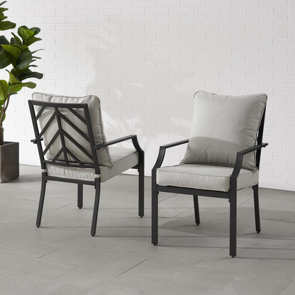 Otto 2-piece outdoor dining chair set by Start2Finish, featuring two modern metal chairs with armrests and woven seats for patio dining.