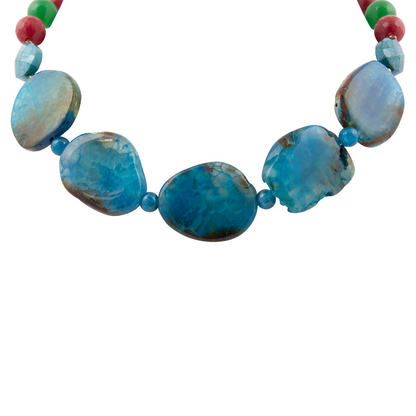 Jeweled blue agate chunky golden necklace with intricate beads and gemstone details, styled for elegant jewelry fashion.