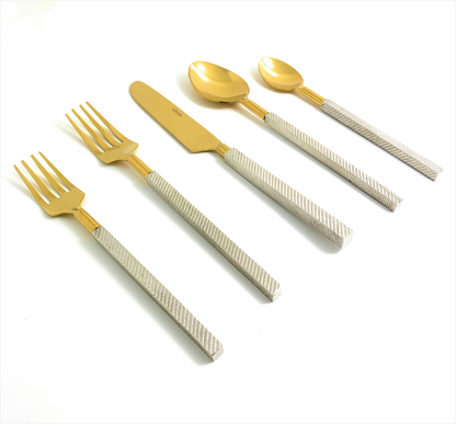Start2Finish modern stainless steel flatware set of 20 pieces, including forks, knives, spoons, and serving utensils on a clean table.