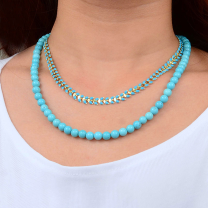 Blue turquoise magnesite layered necklace with a golden chevron pendant, stylish jewelry piece from Start2Finish.