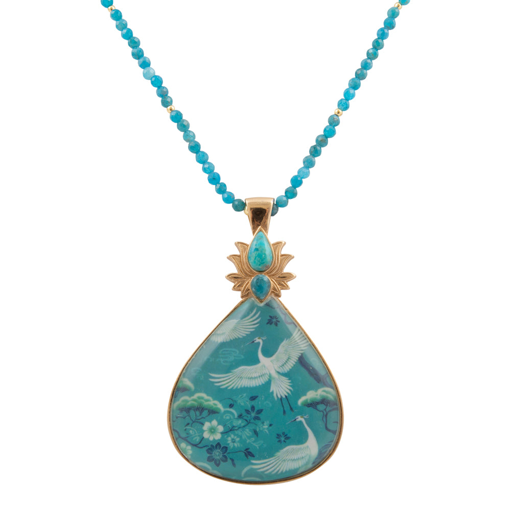 Start2Finish Heron Flight Blue Teal Apatite pendant necklace featuring a golden chain and a detailed heron motif.