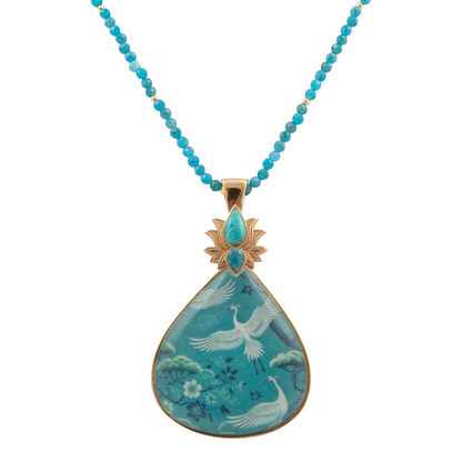 Start2Finish Heron Flight Blue Teal Apatite pendant necklace featuring a golden chain and a detailed heron motif.