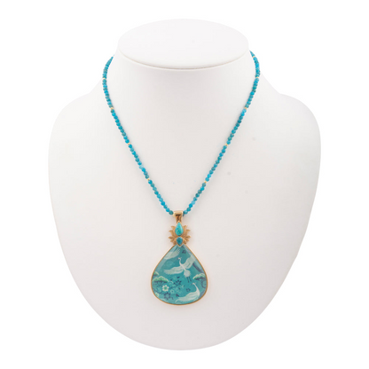 Heron Flight Blue Teal Apatite pendant necklace with golden chain from Start2Finish, showcasing a detailed bird design and vibrant stone.