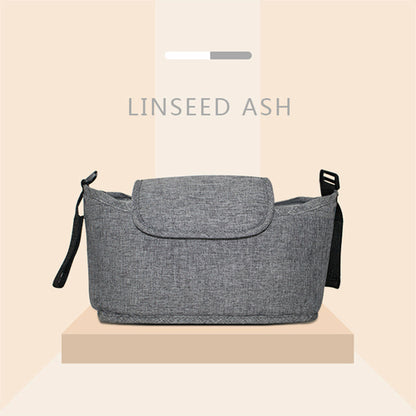 Maroon Asteria stroller bag and organizer with multiple pockets for parent and stroller accessories, attached to a pram.